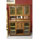 Edwardian Arts & Crafts: Oak dresser, mirror backed with glazed doors. The base with central
