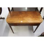 19th cent. Mahogany tea table on square tapering supports.