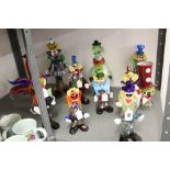 Murano glass clowns, multi colours. 12ins, 9½ins, 9ins, 8¾ins, 8ins, 8½ins. 7¾ins x 2. Plus a