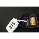 19th cent. Sewing Requisites: Yellow metal (tests 9ct) thimble, blue enamel initials A E I, chased