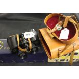 Binoculars: Green Cat 8x30 coated optics in leather case.