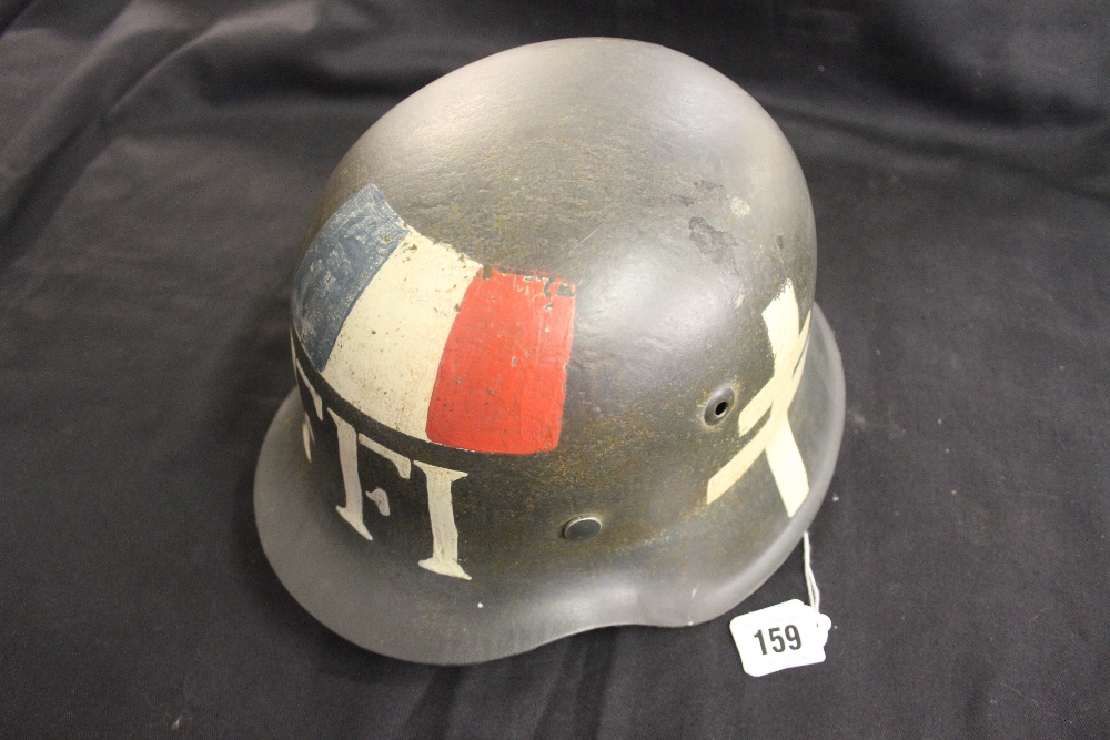 Militaria: WWII German M42 steel helmet with free French marking over Waffen SS decal.