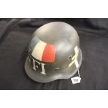 Militaria: WWII German M42 steel helmet with free French marking over Waffen SS decal.