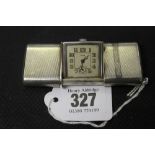 Clocks: Art deco sterling silver cased Eszaha travel clock with pull out sliding mechanism.