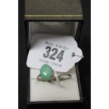 Hallmarked Jewellery: 18ct. Gold ring set with oval light green jade stone 3.8 grams inclusive