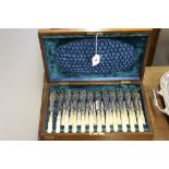 Late 19th early 20th cent. Plate: Twelve place setting of mother of pearl handled fish knives and