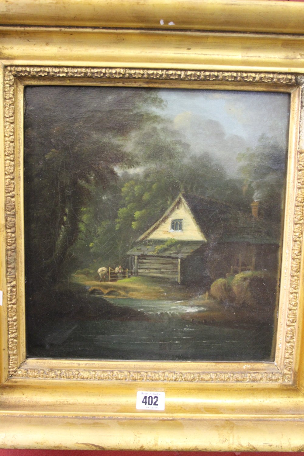 19th cent. English School: Oil on canvas of a mill by a stream in woodland, unsigned in heavy gilt