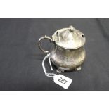 Hallmarked Silver: 17th cent. Style lidded mustard with shell handle and floriate engraving,