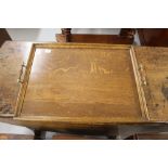 20th cent. Oak butlers tray with brass turned handles. 23ins. x 17ins.