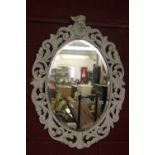 Early 19th cent. White painted over mantel mirror, floral carved frame with a head finial. 29ins.