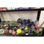 20th cent. Paperweights: Sphere, pyramid, containing flowers, swirls, fruit shape etc 1 x box approx