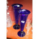 Glass: 20th cent. Bristol blue graduated trumpet vases on circular bases - a pair. 11½ins.