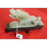 20th cent. Chinese green hard stone carved Dragon on treen base 9½ins. length x 4ins. height.
