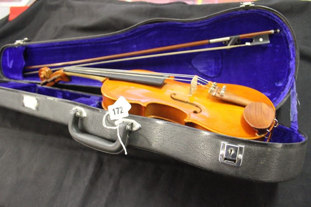 Musical Instruments: A student violin case and bow - Stentor label.