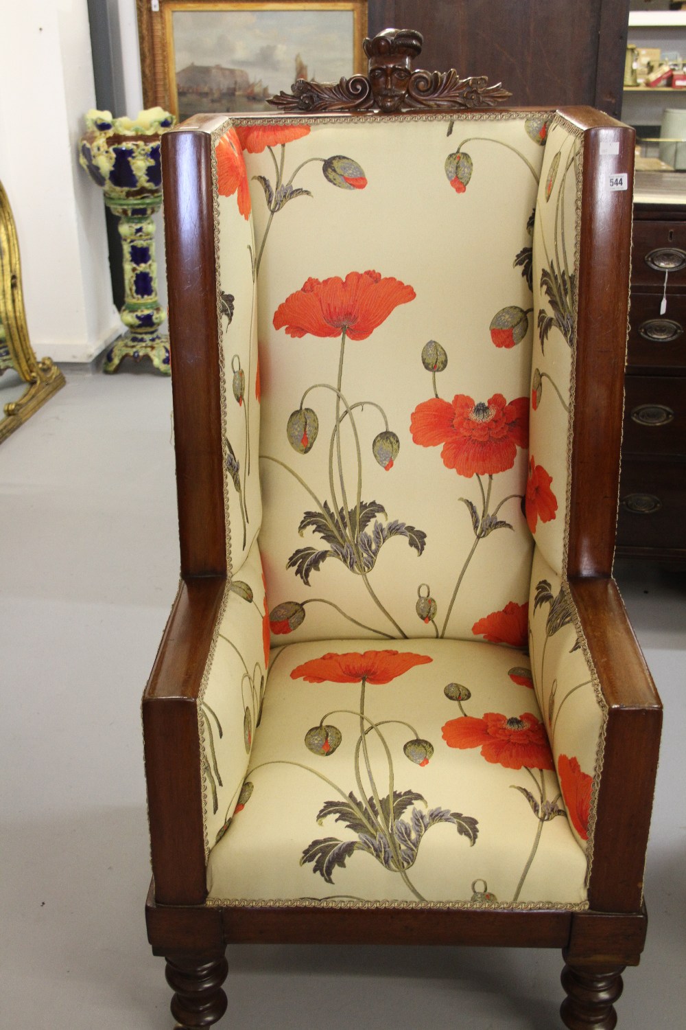 19th cent. Mahogany wing back chair, upholstered in a contemporary style. The chair has a later