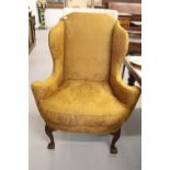 George II walnut upholstered wing armchair with back stretcher replaced in beech.