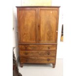 19th cent. Figured mahogany linen press with 4 slides over 3 graduated drawers.