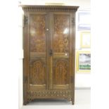 19th cent. Oak & marquetry hall cupboard in an earlier style. Four panels; two with floral motifs