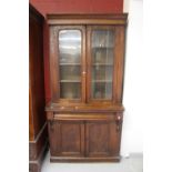 19th cent. Mahogany bookcase cupboard rising off plinth 41ins. x 70ins. x 16ins.