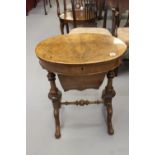 19th cent. Burr walnut oval work table, the top opening to revel a series of compartments and the