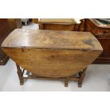Late 17th/early 18th cent. Oak gate leg table with barrelled supports on block curved feet. 46ins. x