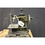 19th cent. Tinplate: Toy sewing machine - black stove enamel decoration.