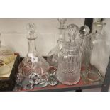Glassware: 20th cent. Cut glass decanters of various forms (5) with spare stoppers. (5).