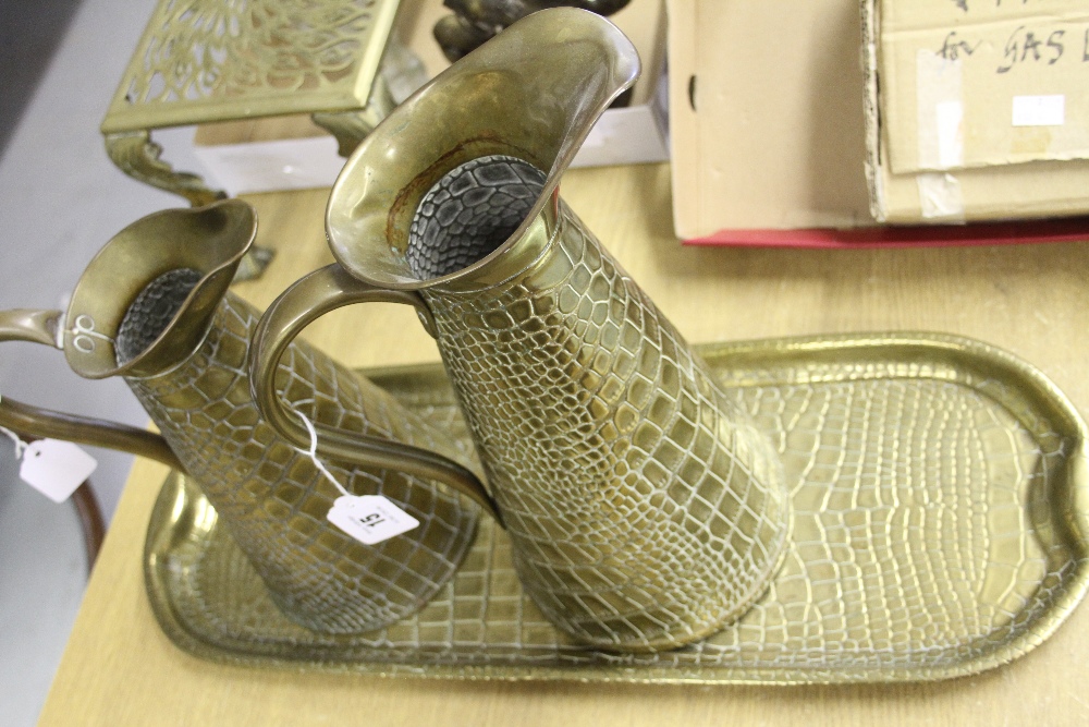 20th cent. Arts & Crafts Brassware: J. Sankey Oblong tray and two jugs in a crocodile skin design.