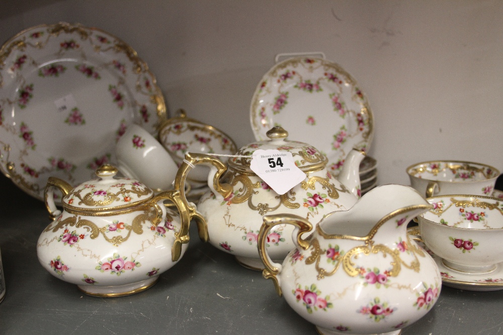 Late 19th/ early 20th cent. Ceramics: hand painted part tea set white ground decorated with pink