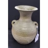 Chinese Ceramics: Han Dynasty stone glaze 2 handled vase with incised decoration to neck. 7ins.
