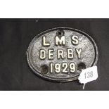 Railwayania: L.M.S. Cast iron oval plaque, Derby 1929. 4½ins. x 3½ins.