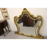 19th cent. Gilt frame mirror. The frame shaped with large shell finial with mirror image shape