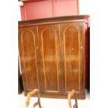 19th cent. Mahogany compactum, dome moulding to door fronts, double hanging compartments, single