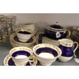 20th cent. Wedgwood: bone china tea set Mazarine blue banded with gilt vine leaf decoration, pattern