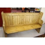 19th cent. Pitch pine pew/bench with bookrack to back and shaped ends. 64ins. x 41½ins. x 17½ins.