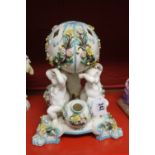 19th cent. Ceramics: Table centre piece possibly Minton, in the form of four cherubs supporting a