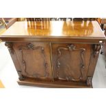 19th cent. Mahogany chiffonier with carved moulding's to the twin door. The whole rising off a