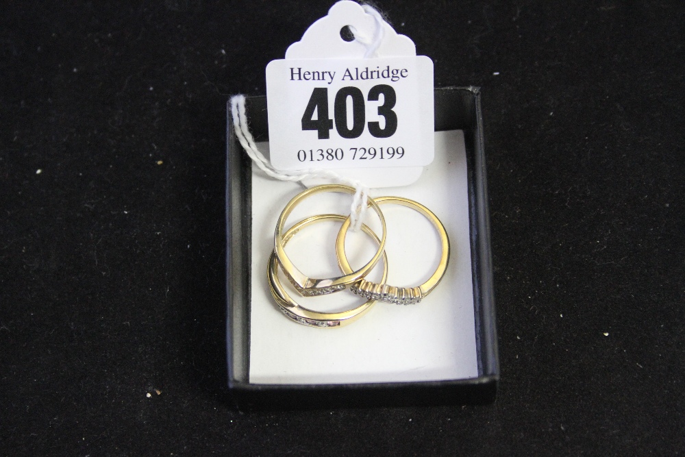 Hallmarked Gold: 9ct. Rings 2 x wishbone rings one with diamond setting, the other with white stones
