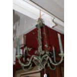 20th cent. Four branch iron chandelier with painted verdigree finish with leaves.