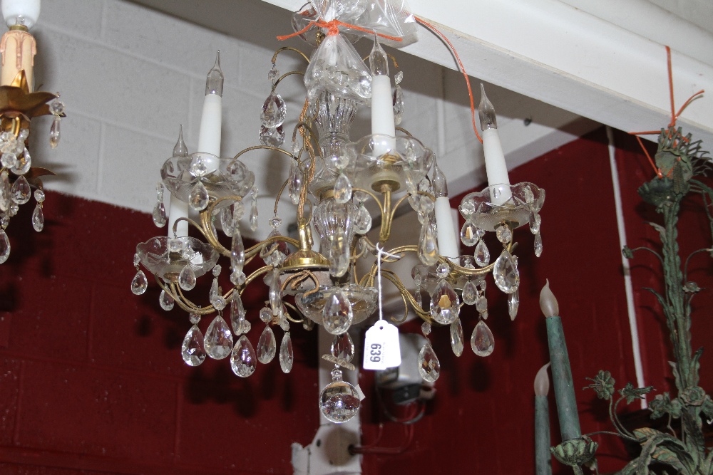 French moulded glass and gilt-metal six-branch chandelier, of small size, the baluster stem