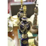 20th cent. Table lamps, blue ceramic and bronzed metal mounted lamps decorated with rams heads and
