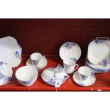 20th cent. Ceramics: Shelley part tea set, blue and pink daisies No 12216. Cups & saucers x 6, sugar