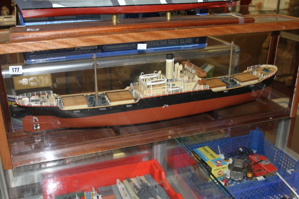 Models: Scale model of a cargo vessel, mounted in a display case. 40½ins. x 14¼ins. x 7ins.