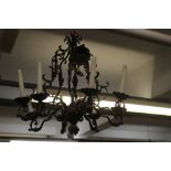 17th cent. Style wrought iron bird cage chandelier, the scrolled and foliate body supporting eight