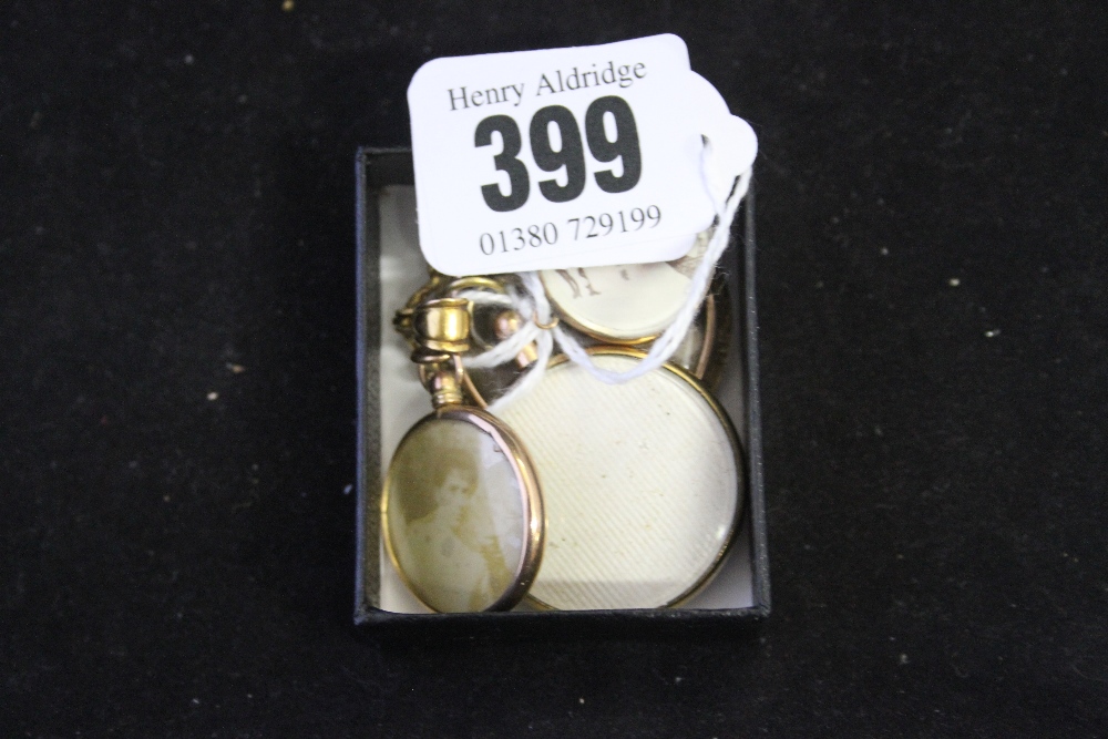 Hallmarked Gold photo lockets, a 9ct. and 1 yellow metal. (3)