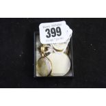 Hallmarked Gold photo lockets, a 9ct. and 1 yellow metal. (3)