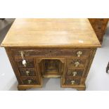 19th cent. Oak Knee hole desk with carving to the 7 drawers and central door. The whole open bracket