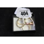Hallmarked Gold: 9ct belt ring x 2 plus mixed gold trilogy ring and a wishbone ring 13g.inc.