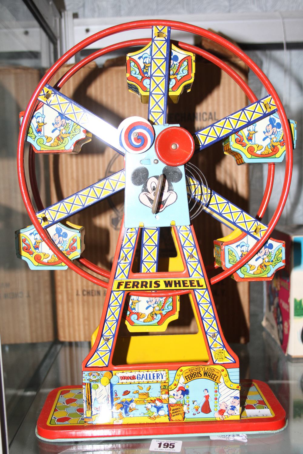 Toys: 1950s Mickey Mouse tin plate wind-up Ferris Wheel - boxed. 16½ins.