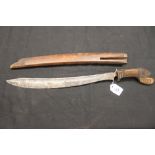 Edged Weapons: Indonesian Parang steel blade carved grip possibly Garudo plain treen scabbard a/f.